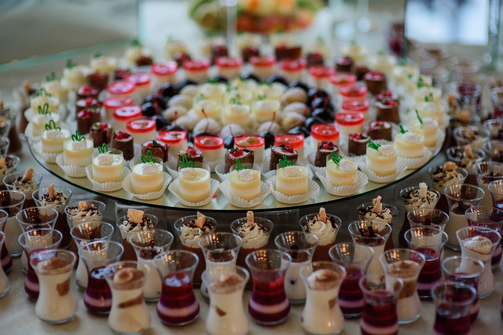 Large round dishes with cold desserts of white and black chocolate