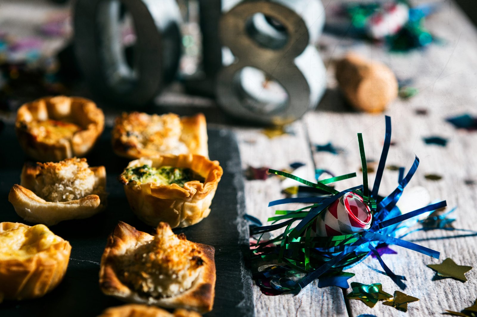 A series celebrating New Year's Eve, some with 2018 numerals.  Lots of confetti, champagne, etc. Good for backgrounds of ads.